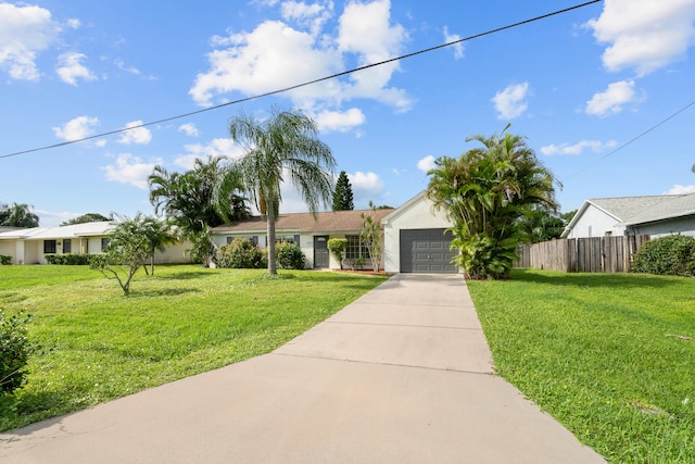 ranch-style house featuring a front lawn and a garage