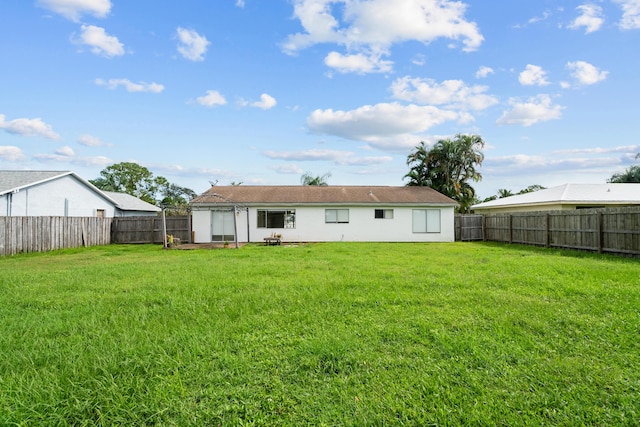 2222 SE Carnation Rd, Port Saint Lucie, FL 34952 - back of property featuring stucco siding