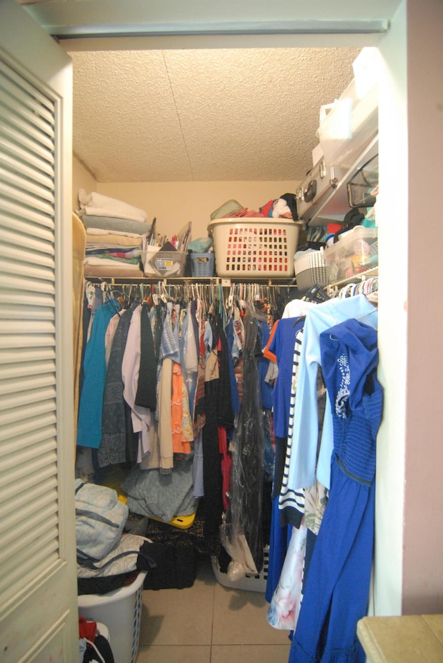 spacious closet with tile patterned flooring