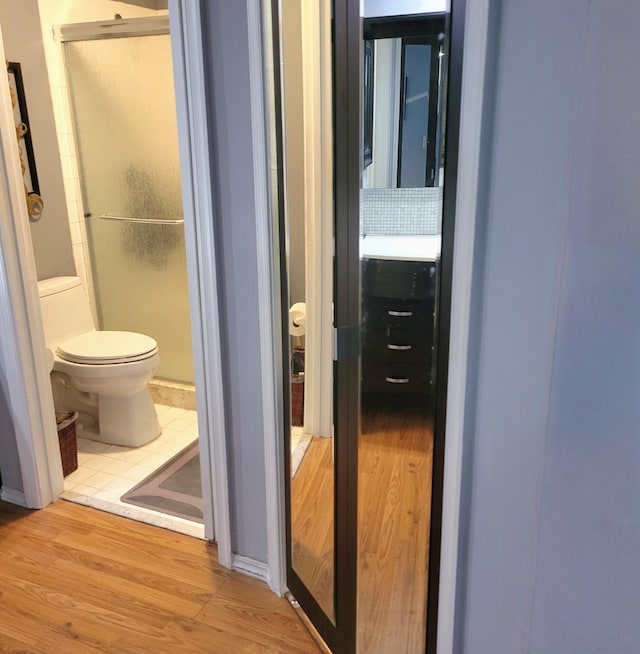 corridor with wood-type flooring