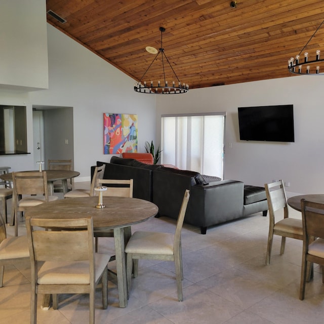 tiled dining space featuring wood ceiling, a notable chandelier, and high vaulted ceiling