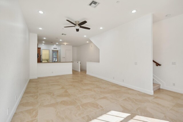 tiled living room featuring ceiling fan