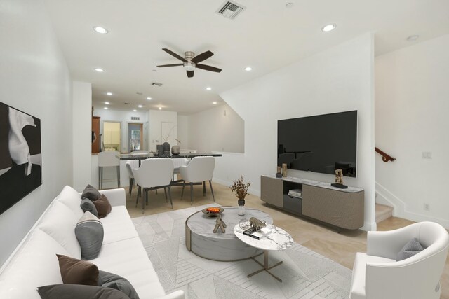 unfurnished living room featuring ceiling fan