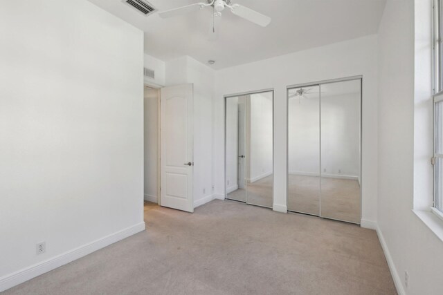 clothes washing area featuring cabinets and separate washer and dryer