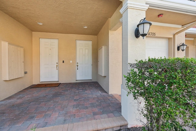 doorway to property featuring a garage