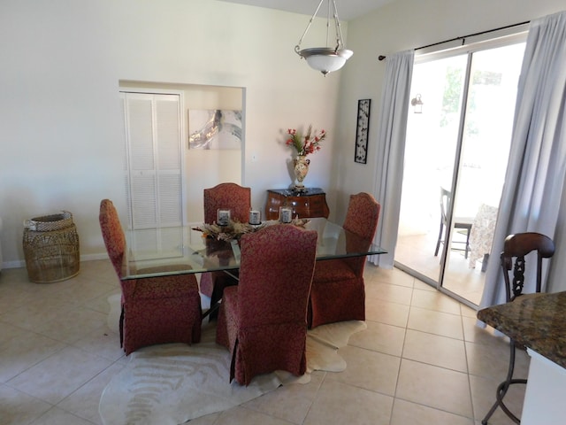 dining room with light tile patterned flooring