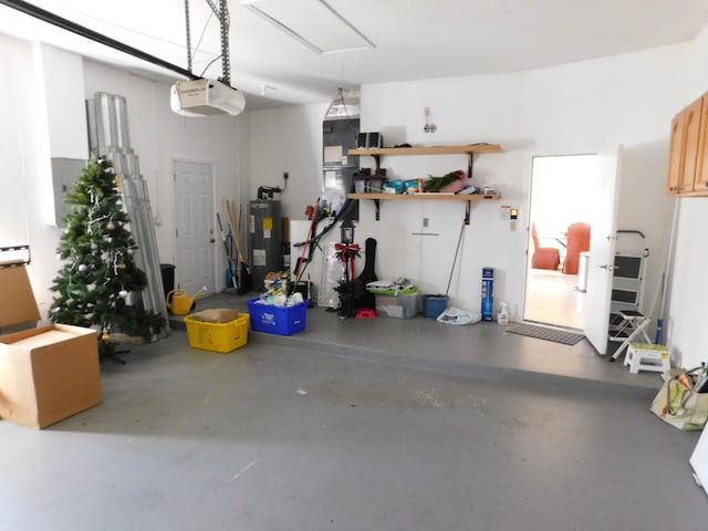 garage featuring a garage door opener and water heater