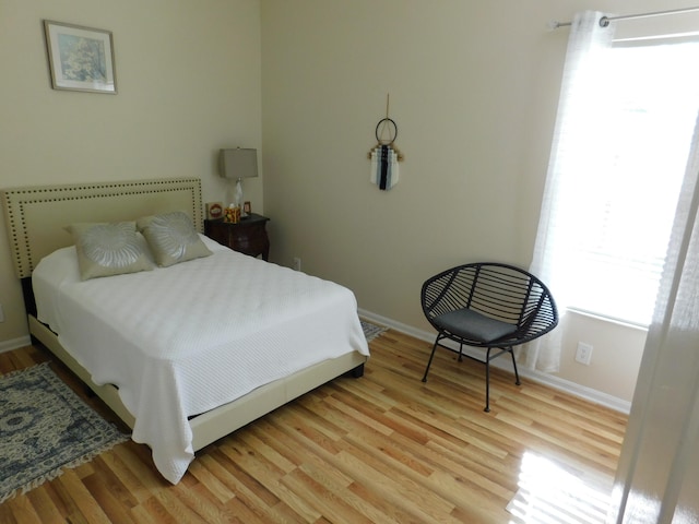 bedroom with light hardwood / wood-style flooring