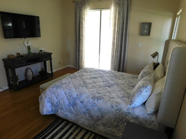 bedroom with hardwood / wood-style floors