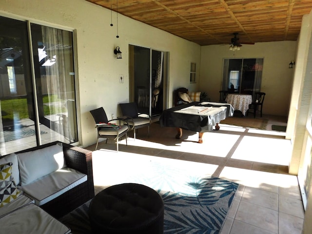 exterior space featuring ceiling fan and wooden ceiling