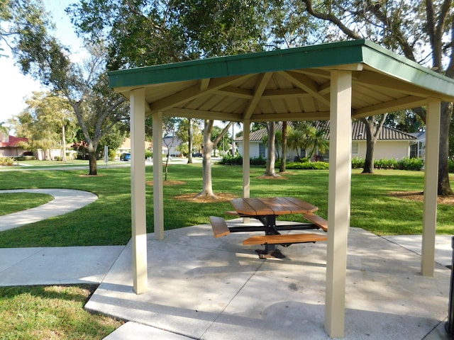 view of property's community with a yard and a gazebo