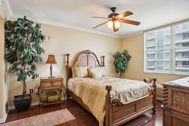 bedroom with ornamental molding, dark wood-type flooring, a textured ceiling, and ceiling fan