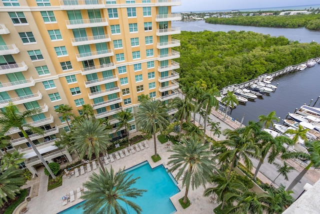 exterior space featuring a community pool and a water view