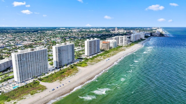 drone / aerial view with a beach view and a water view