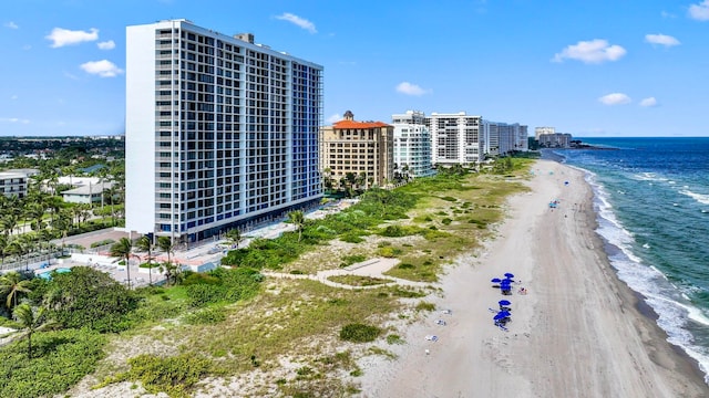 aerial view featuring a view of the beach and a water view