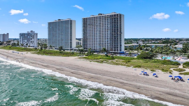 aerial view featuring a view of the beach and a water view