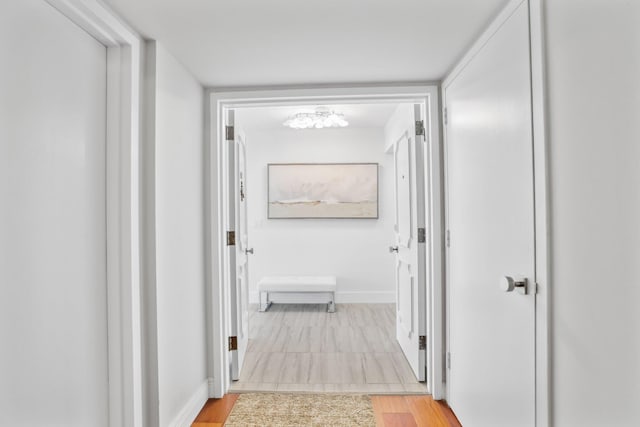 hall with light hardwood / wood-style flooring