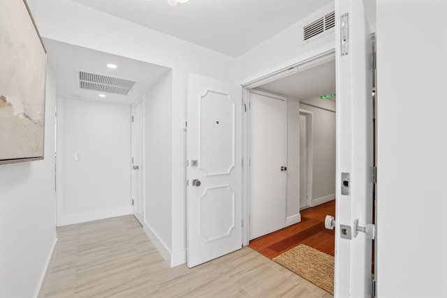 corridor featuring light hardwood / wood-style flooring