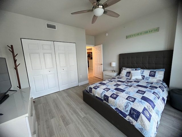 bedroom with a closet, ceiling fan, and light hardwood / wood-style floors