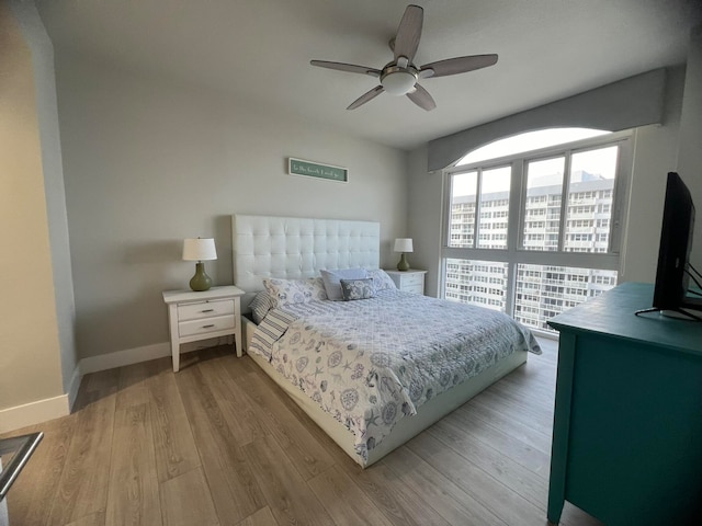 bedroom featuring light hardwood / wood-style flooring and ceiling fan