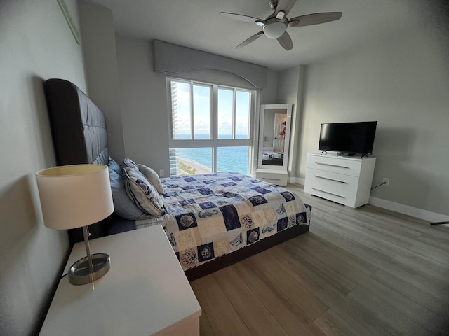 bedroom featuring ceiling fan and light hardwood / wood-style flooring