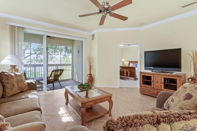 dining room featuring ceiling fan with notable chandelier, light tile patterned flooring, and ornamental molding