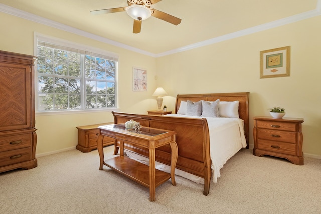 bedroom with ceiling fan, light colored carpet, and crown molding