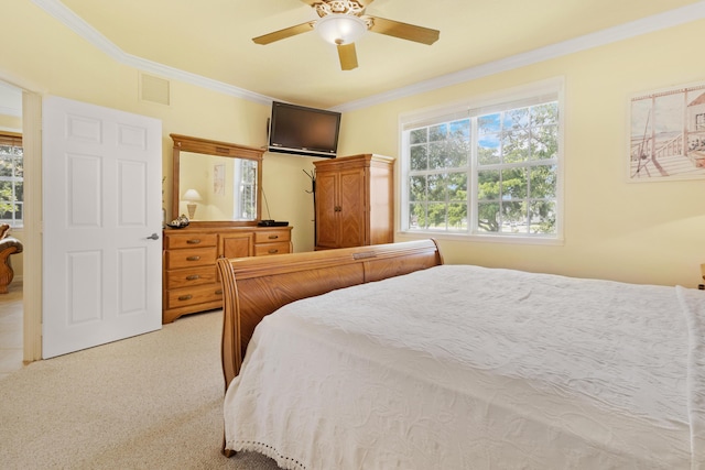 bedroom featuring light carpet, ceiling fan, and ornamental molding