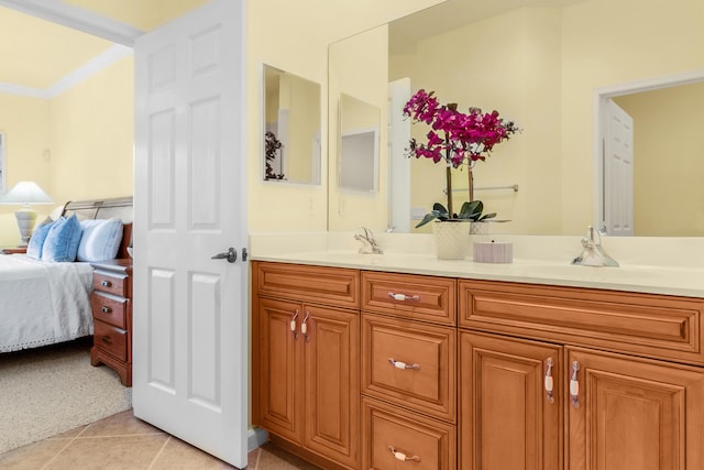 bathroom featuring tile patterned floors, vanity, and ornamental molding