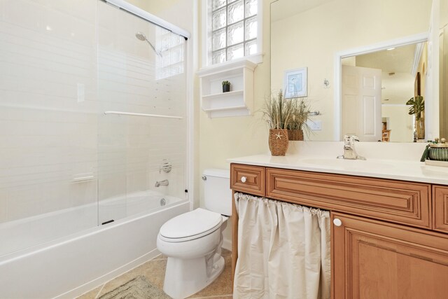 full bathroom with tub / shower combination, toilet, vanity, and tile patterned flooring