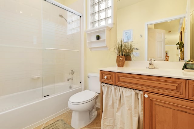 full bathroom with shower / tub combination, vanity, toilet, and tile patterned flooring