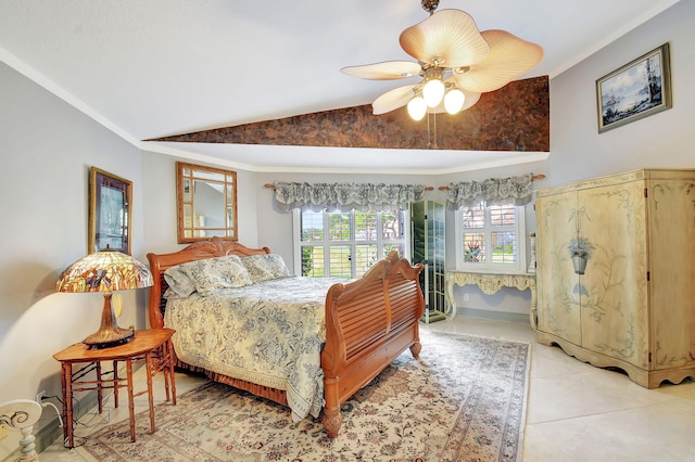 bedroom featuring ceiling fan, lofted ceiling, and light tile patterned flooring