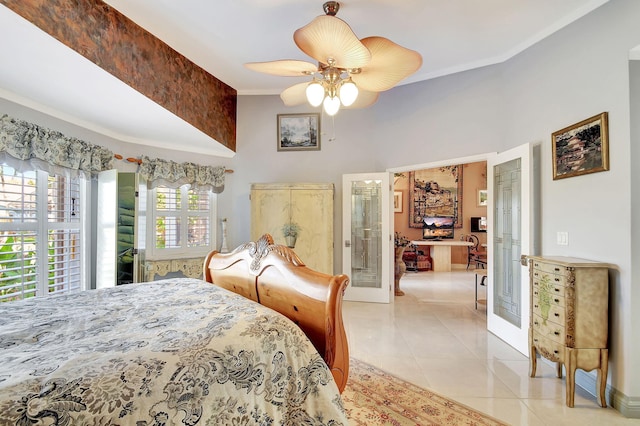 tiled bedroom featuring french doors, multiple windows, crown molding, and ceiling fan