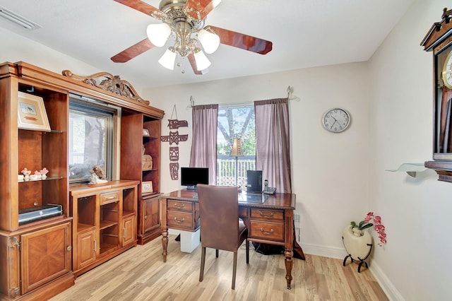 office space with light wood-type flooring and ceiling fan