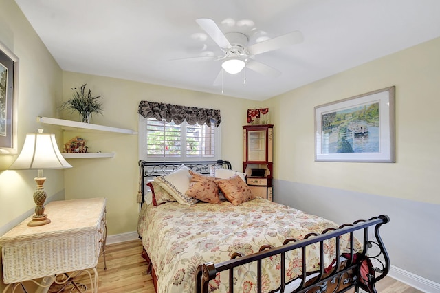 bedroom featuring ceiling fan and light hardwood / wood-style floors