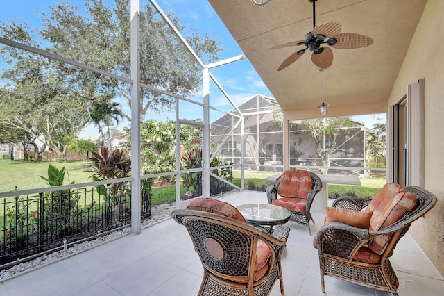 sunroom / solarium with ceiling fan and a healthy amount of sunlight