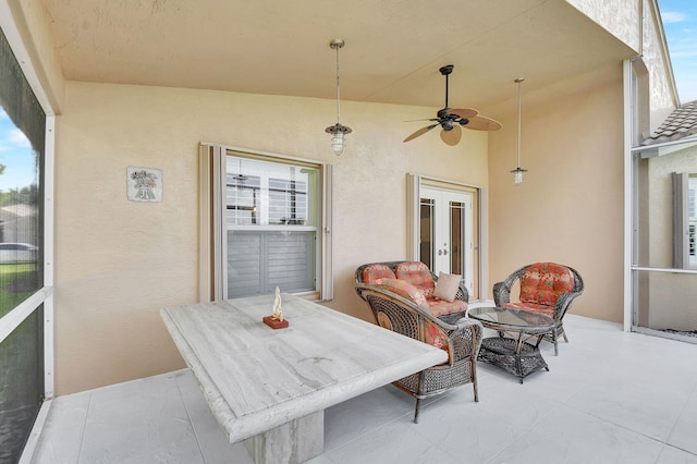 exterior space with outdoor lounge area, ceiling fan, and french doors