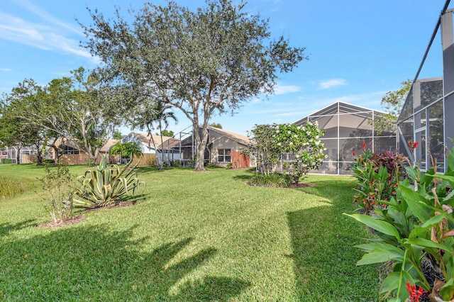 view of yard with a lanai