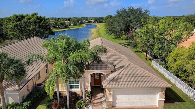 birds eye view of property with a water view