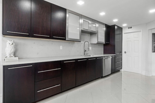 kitchen with sink, dishwasher, decorative backsplash, and light tile patterned floors