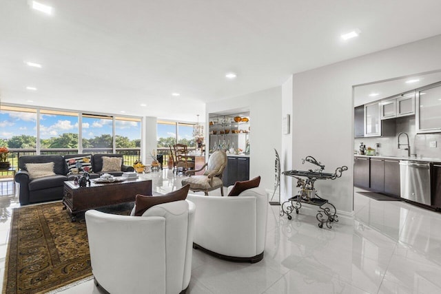 living room with expansive windows and sink