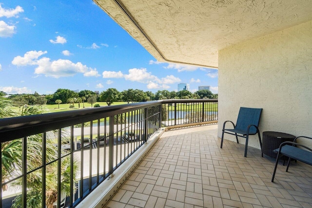 balcony featuring a water view