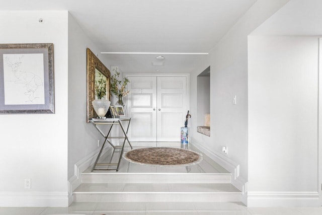 hall featuring tile patterned floors