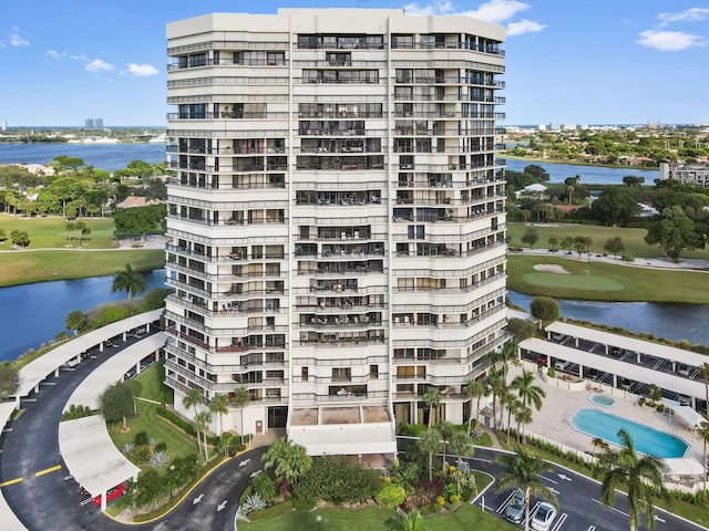 view of building exterior with a water view