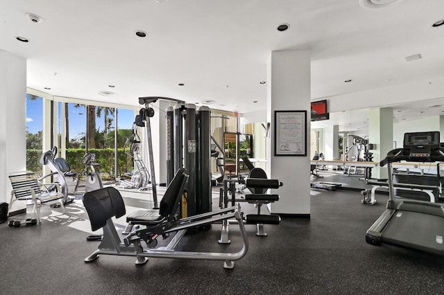 exercise room with floor to ceiling windows