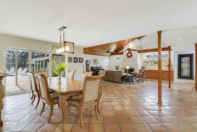 dining space featuring vaulted ceiling, ceiling fan, and wooden ceiling