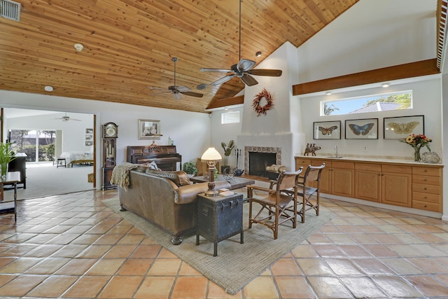 tiled living room featuring wood ceiling, sink, and high vaulted ceiling