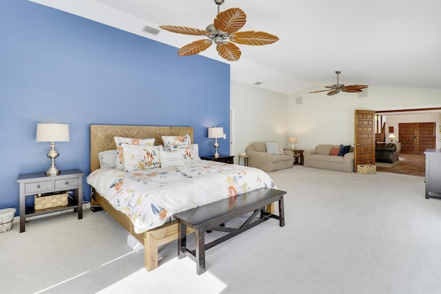 carpeted bedroom with ceiling fan and lofted ceiling