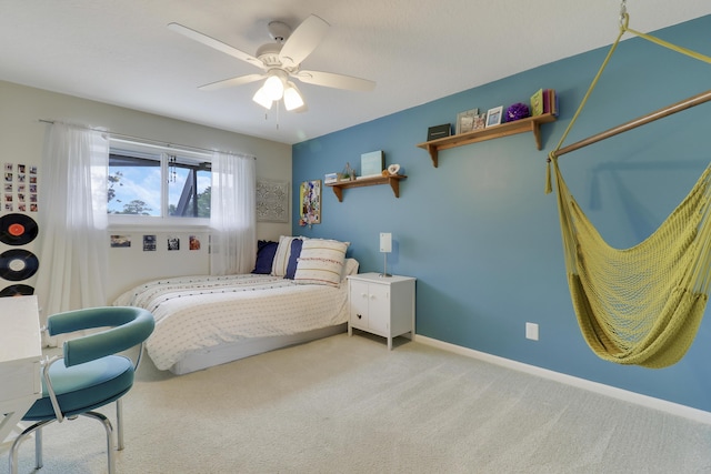 bedroom featuring a ceiling fan and light carpet