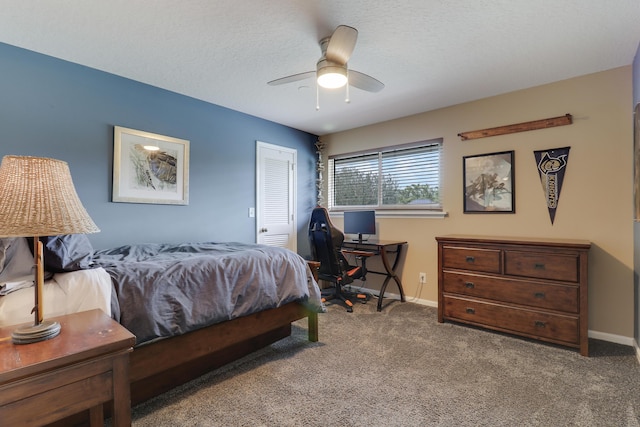 bedroom featuring ceiling fan, a closet, carpet, and a textured ceiling